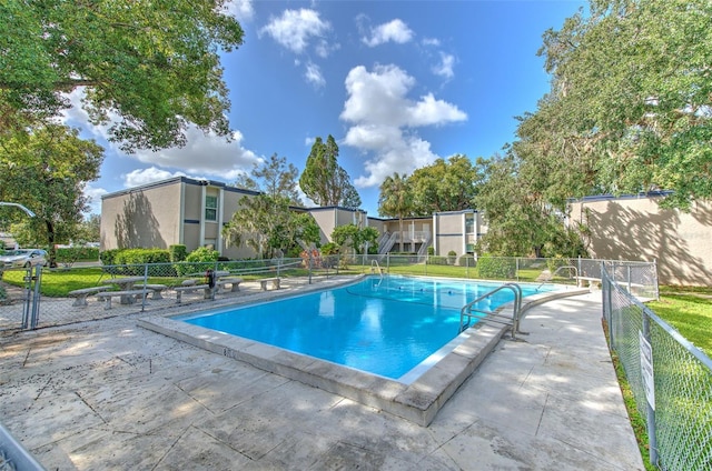 view of swimming pool with a patio