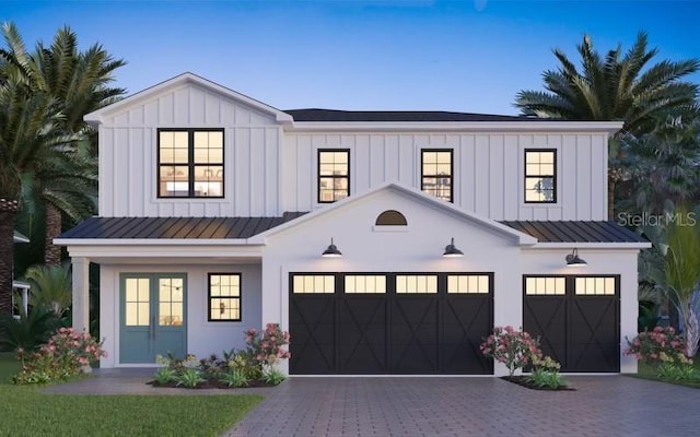 modern inspired farmhouse featuring a garage