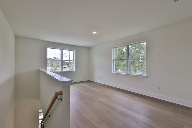 unfurnished room with light hardwood / wood-style floors