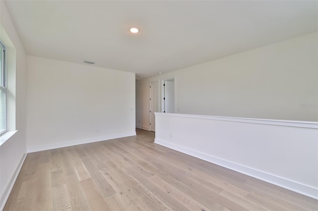 spare room featuring light wood-type flooring