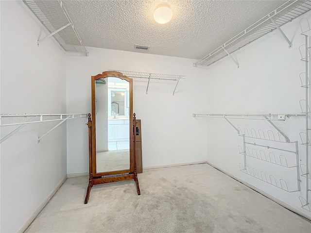 spacious closet featuring visible vents