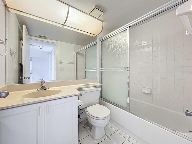 full bath featuring tile patterned flooring, combined bath / shower with glass door, vanity, and visible vents