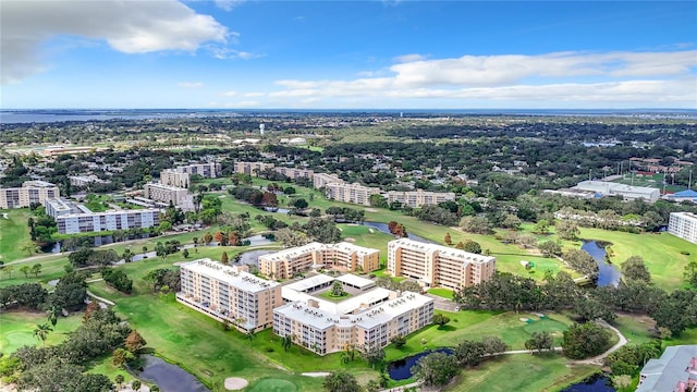 birds eye view of property with a city view, view of golf course, and a water view