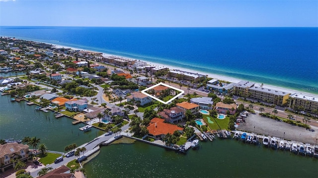 aerial view with a water view and a view of the beach