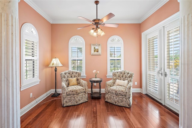 living area featuring crown molding, french doors, ceiling fan, and dark hardwood / wood-style flooring