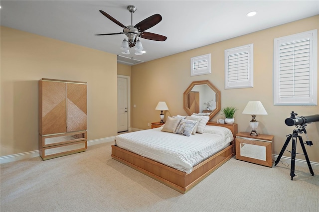 carpeted bedroom featuring ceiling fan