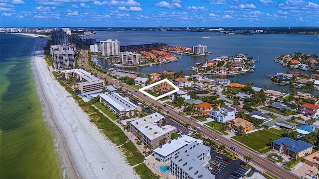 aerial view featuring a view of the beach and a water view