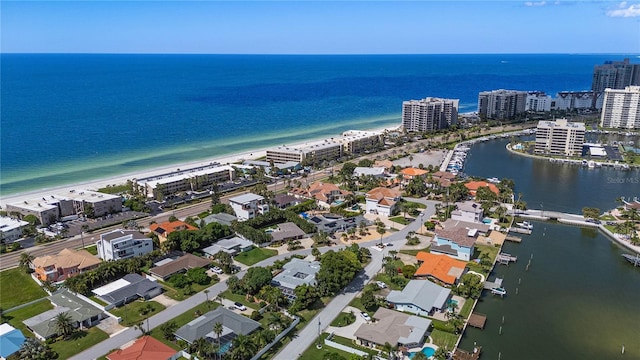 aerial view featuring a water view and a beach view