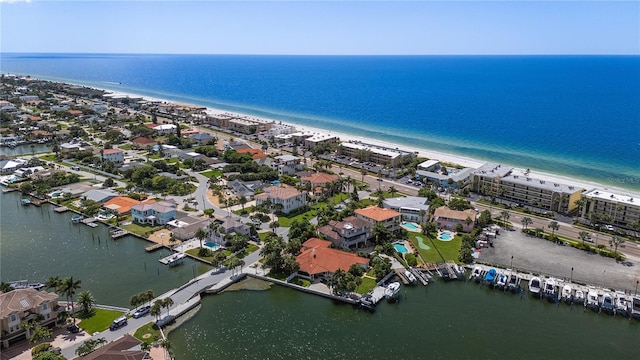 drone / aerial view with a water view and a view of the beach