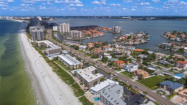 aerial view featuring a water view and a beach view