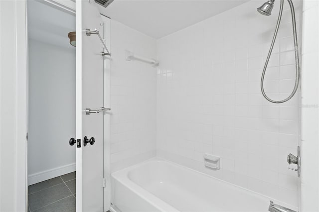 bathroom with tile patterned flooring and tiled shower / bath