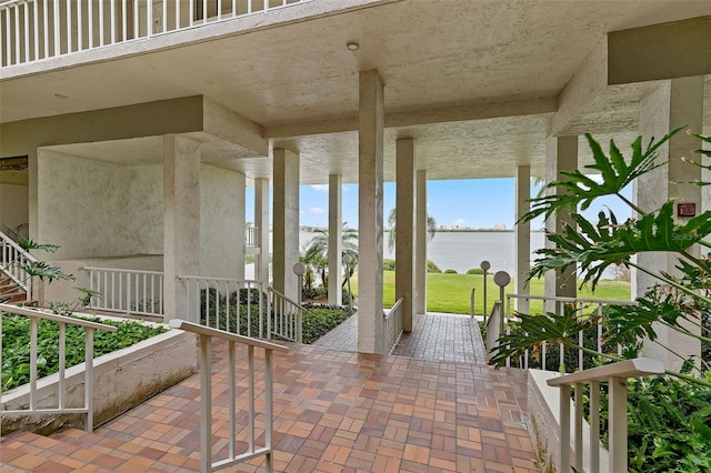 view of patio featuring a water view