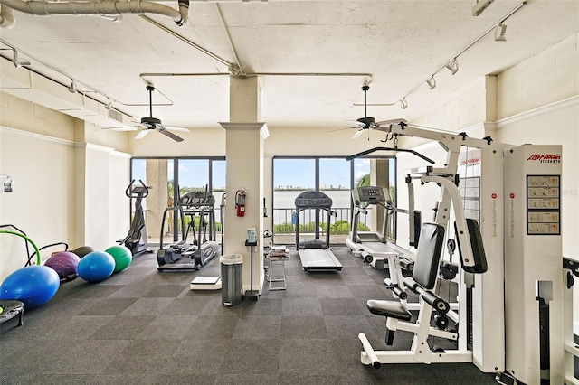 exercise room with ceiling fan