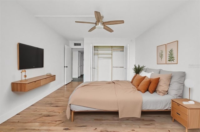 bedroom featuring ceiling fan and light hardwood / wood-style floors