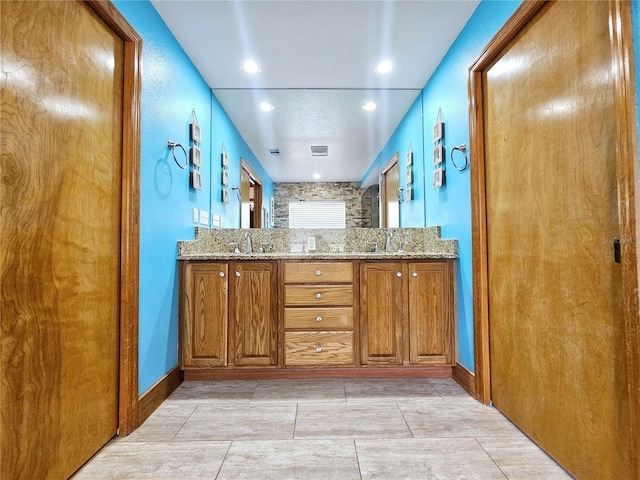 bathroom with vanity and tile patterned flooring