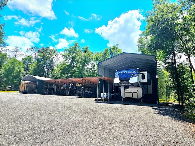 view of parking / parking lot with a carport