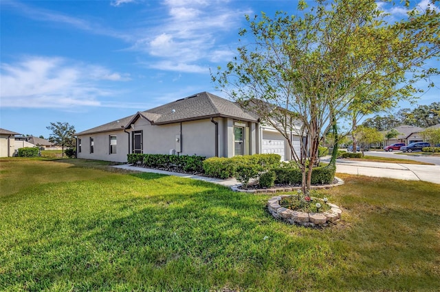 view of home's exterior featuring a garage and a lawn