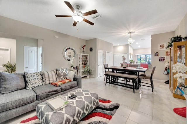 living room featuring ceiling fan and light tile patterned flooring