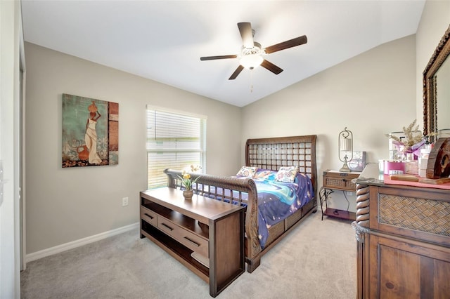 carpeted bedroom featuring ceiling fan and vaulted ceiling