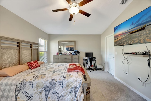 bedroom with lofted ceiling, light colored carpet, and ceiling fan