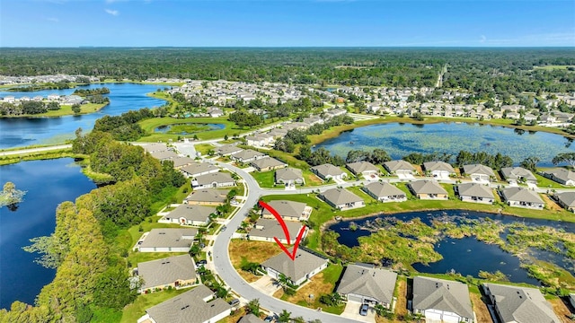 birds eye view of property featuring a water view