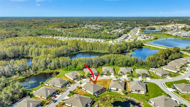 birds eye view of property with a water view