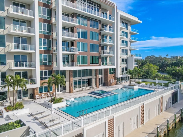 view of pool featuring a patio area and a community hot tub