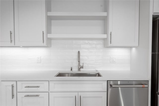 kitchen featuring sink, white cabinetry, and dishwasher