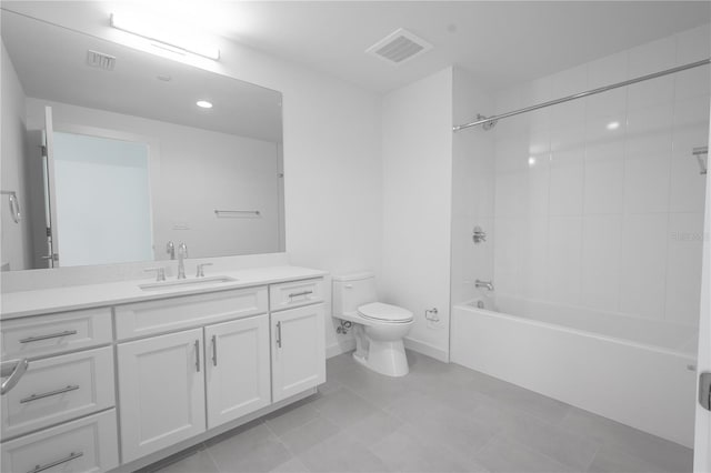 full bathroom featuring vanity, toilet, tile patterned flooring, and tiled shower / bath