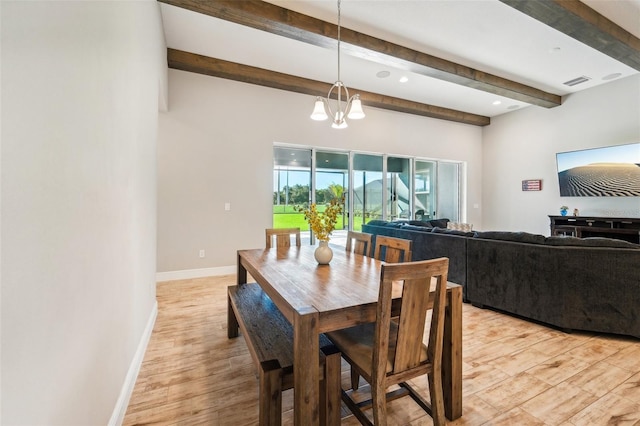 dining room featuring beam ceiling, an inviting chandelier, and light hardwood / wood-style floors