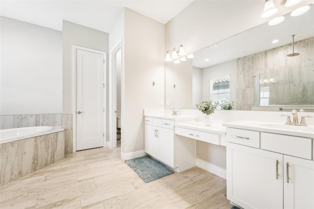 bathroom with vanity and separate shower and tub