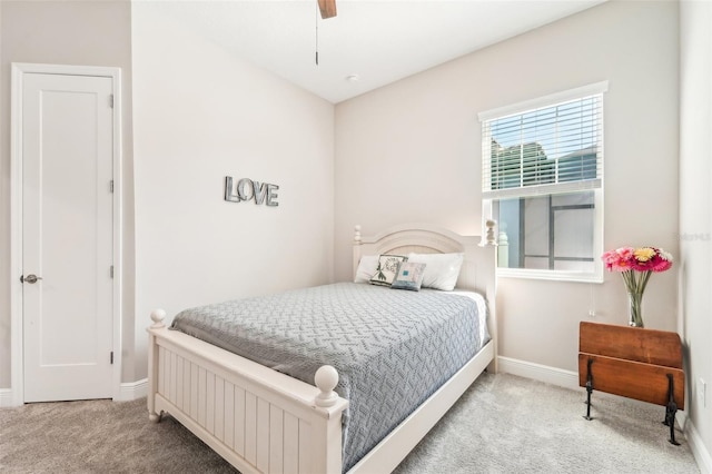 bedroom with ceiling fan and light carpet