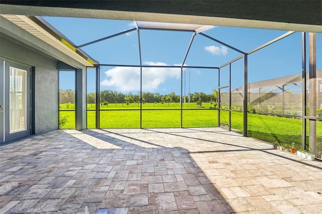 view of patio with glass enclosure