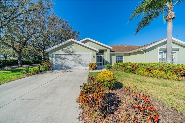 single story home with a front lawn and a garage