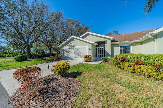 ranch-style home featuring a front lawn and a garage