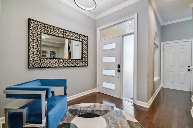 foyer entrance with ornamental molding and dark hardwood / wood-style floors