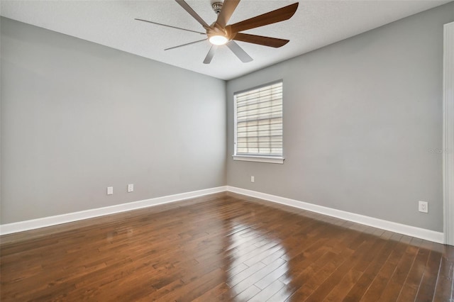 spare room featuring a textured ceiling, dark hardwood / wood-style floors, and ceiling fan