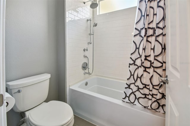 bathroom featuring shower / tub combo with curtain and toilet