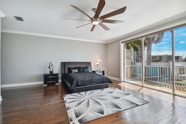 bedroom featuring dark hardwood / wood-style flooring, a textured ceiling, access to outside, and ceiling fan