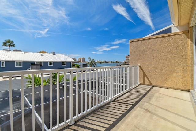 balcony featuring a water view