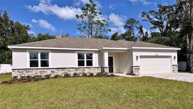 view of front facade with a garage and a front lawn