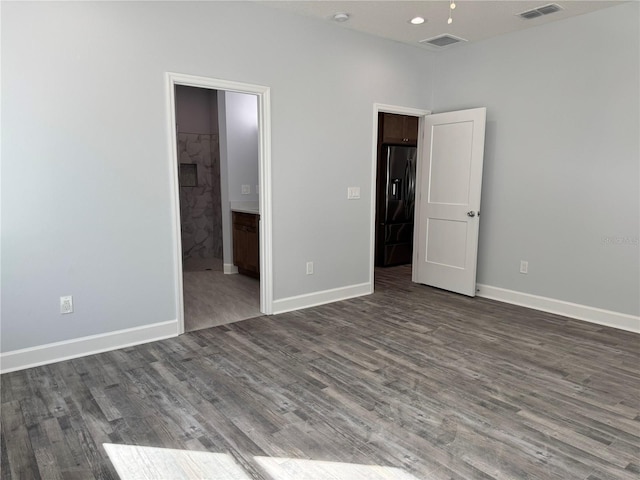 unfurnished room featuring wood-type flooring