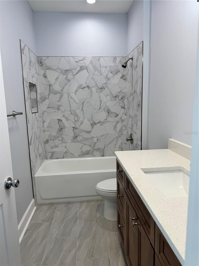 full bathroom with shower / tub combination, vanity, and toilet