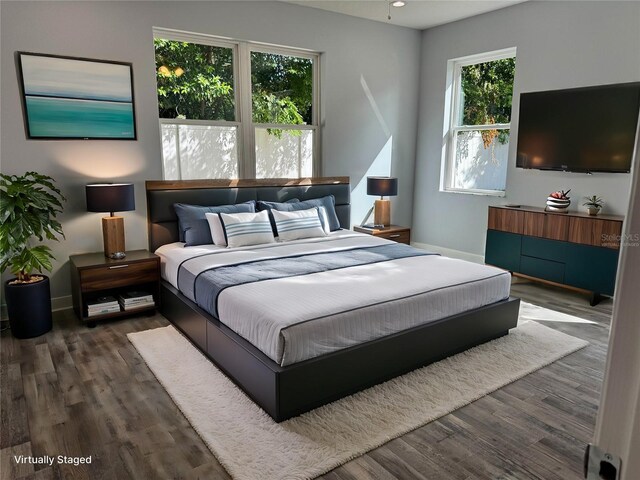 bedroom featuring dark hardwood / wood-style floors