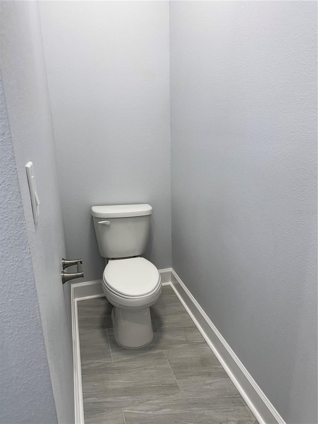 bathroom with tile patterned floors and toilet