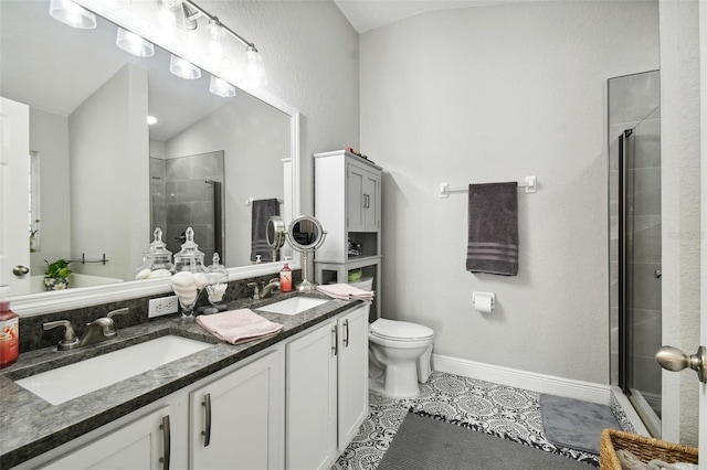 bathroom with lofted ceiling, tile patterned floors, toilet, vanity, and an enclosed shower