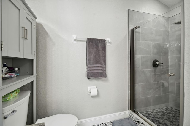 bathroom featuring toilet and walk in shower