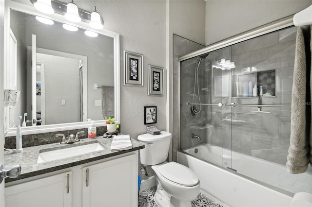 full bathroom featuring toilet, enclosed tub / shower combo, vanity, and tile patterned floors