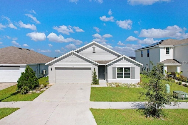 view of front of home featuring a front lawn and a garage