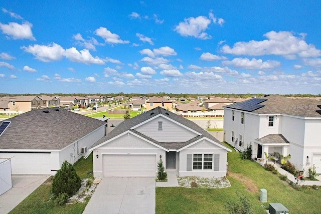 single story home with a front yard and a garage